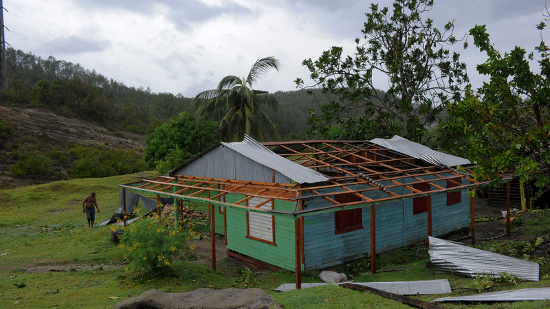 A man surveys damaged property in the Carbonera community of Guantanamo, Cuba following Hurricane Matthew, October 5, 2016. The storm slammed into Haiti and Cuba as a Category Four hurricane on October 4, 2016 but has since been downgraded to three, on a scale of five, by the US National Hurricane Center (NHC). Its winds were howling at 115 miles per hour. (Image: Getty)